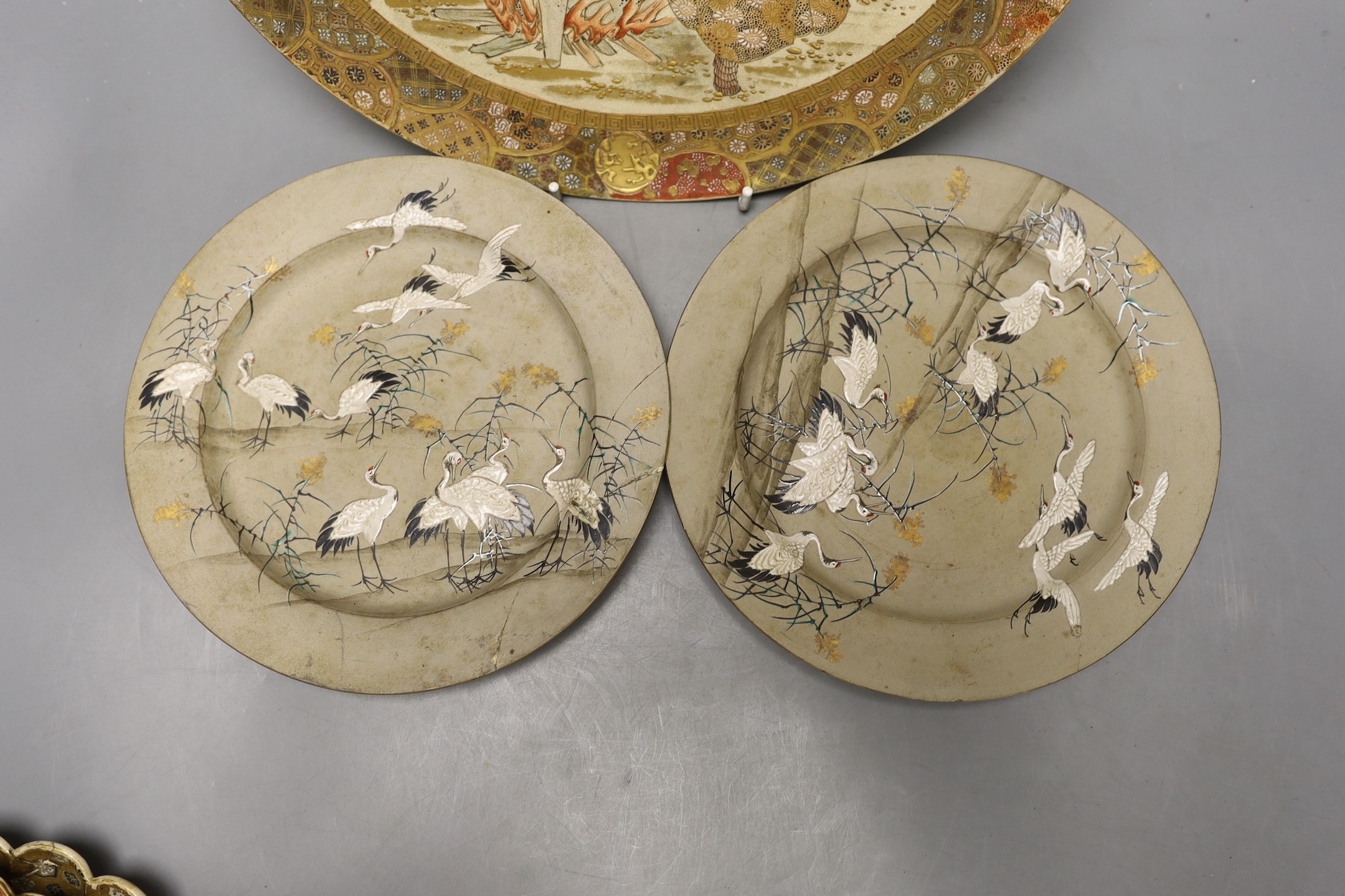 Three Japanese Satsuma dishes and a pair of plates - largest 31cm diameter